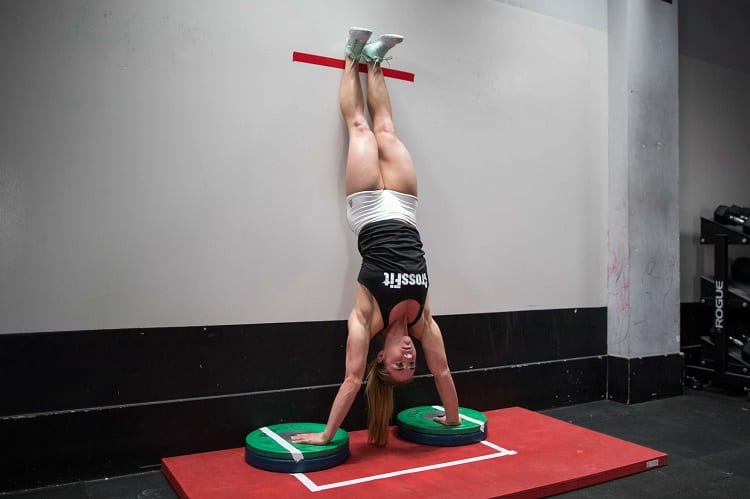 Woman Doing Handstand Push Up